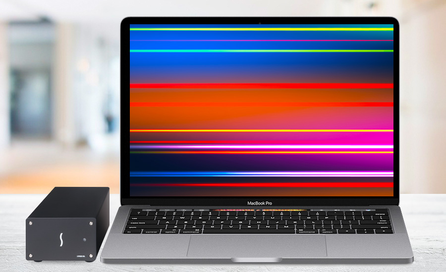 Twin10G next to MacBook Pro.